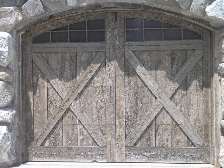 Garage Door / This garage door is constructed using rough gray barnwood